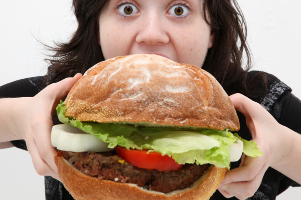 http://nycityeats.com/wordpress/wp-content/uploads/2011/04/woman-eating-giant-burger.jpg
