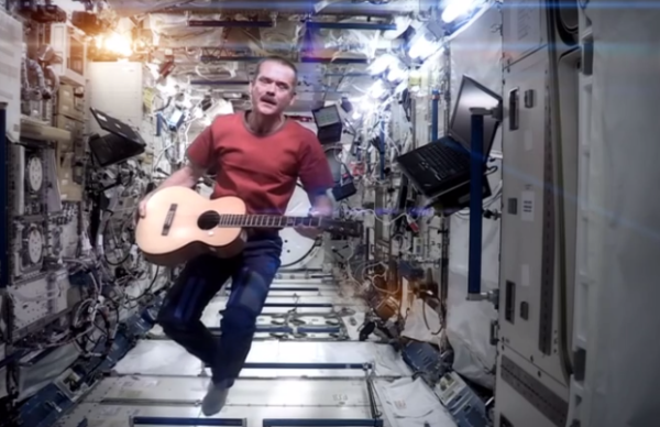 Chris Recording his Video song i the spacecraft flying in weightlessness